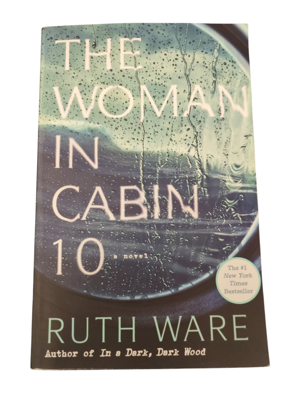 The Woman in Cabin 10 by Ruth Ware - Teal & Navy Paperback Novel
